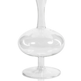 This Footed oval Glass Vase is a twist on a classic form tabletop accessory