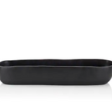 Black Resin troughs by Tina Frey Designs'  is hand-sculpted of black shatter-resistant BPA-free resin and features organic-shaped edges. The food-safe vessel can hold fruit, display decorative objects, or simply serve as a statement piece in the space of your choosing.