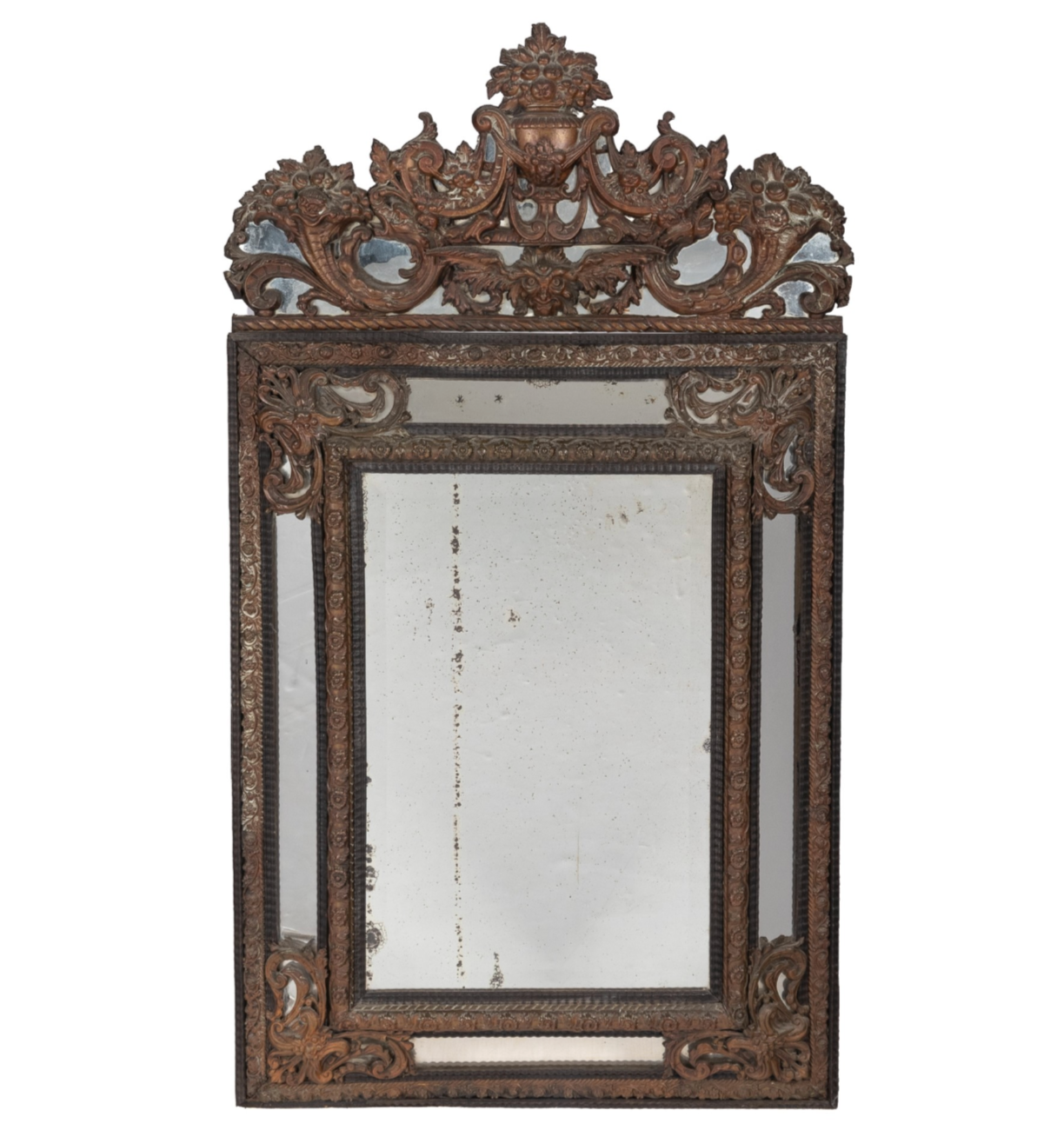 19th Dutch Pressed Mirror is a striking addition and an architectural wall piece defined by its high-relief, sculptural metalwork—most notably created using the repoussé technique