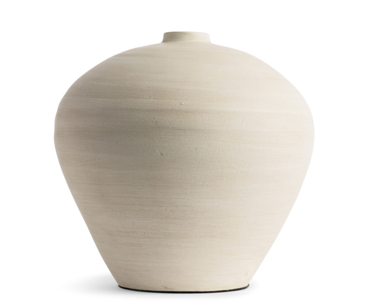 This smooth ceramic vase is combining functionality and sculptural elegance with its hand-formed round silhouette and cream finish