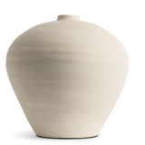 This smooth ceramic vase is combining functionality and sculptural elegance with its hand-formed round silhouette and cream finish