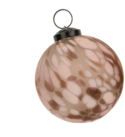 Elevate your holiday decor with the Confetti Glass Ornaments. Hand-blown to create a snowstorm confetti design in milky white and earthy pink, they are completed with a vintage-inspired cap and loop.