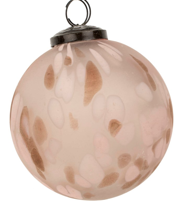 Elevate your holiday decor with the Confetti Glass Ornaments. Hand-blown to create a snowstorm confetti design in milky white and earthy pink, they are completed with a vintage-inspired cap and loop.