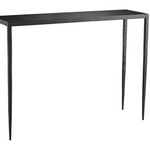 This Hammered Iron Console is Simple and stylish. Crafted from solid iron that has been hammered by hand lending a textured touch to its industrial frame. An ultra-thin top blends into slightly tapered legs that appear delicate but asire extremely steady. Visually lightweight it offers an airy aesthetic