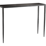 This Hammered Iron Console is Simple and stylish. Crafted from solid iron that has been hammered by hand lending a textured touch to its industrial frame. An ultra-thin top blends into slightly tapered legs that appear delicate but asire extremely steady. Visually lightweight it offers an airy aesthetic