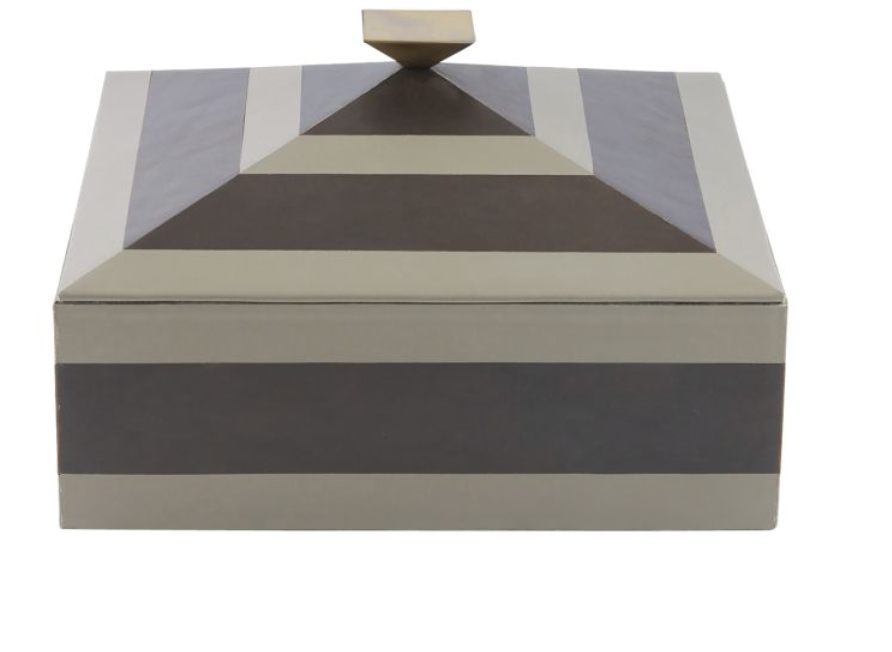 Tonal stripes add a tailored finish to a two-toned dove and graphite leather box. This pyramid-inspired accessory is topped with a bronze-plated handle that reflects its geometric lines. Lined in soft suede. 