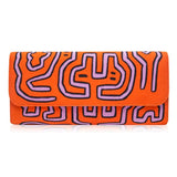 Mola Sasa clutch in orange and pink. Handcrafted by artisans in Columbia with cotton and natural yute.