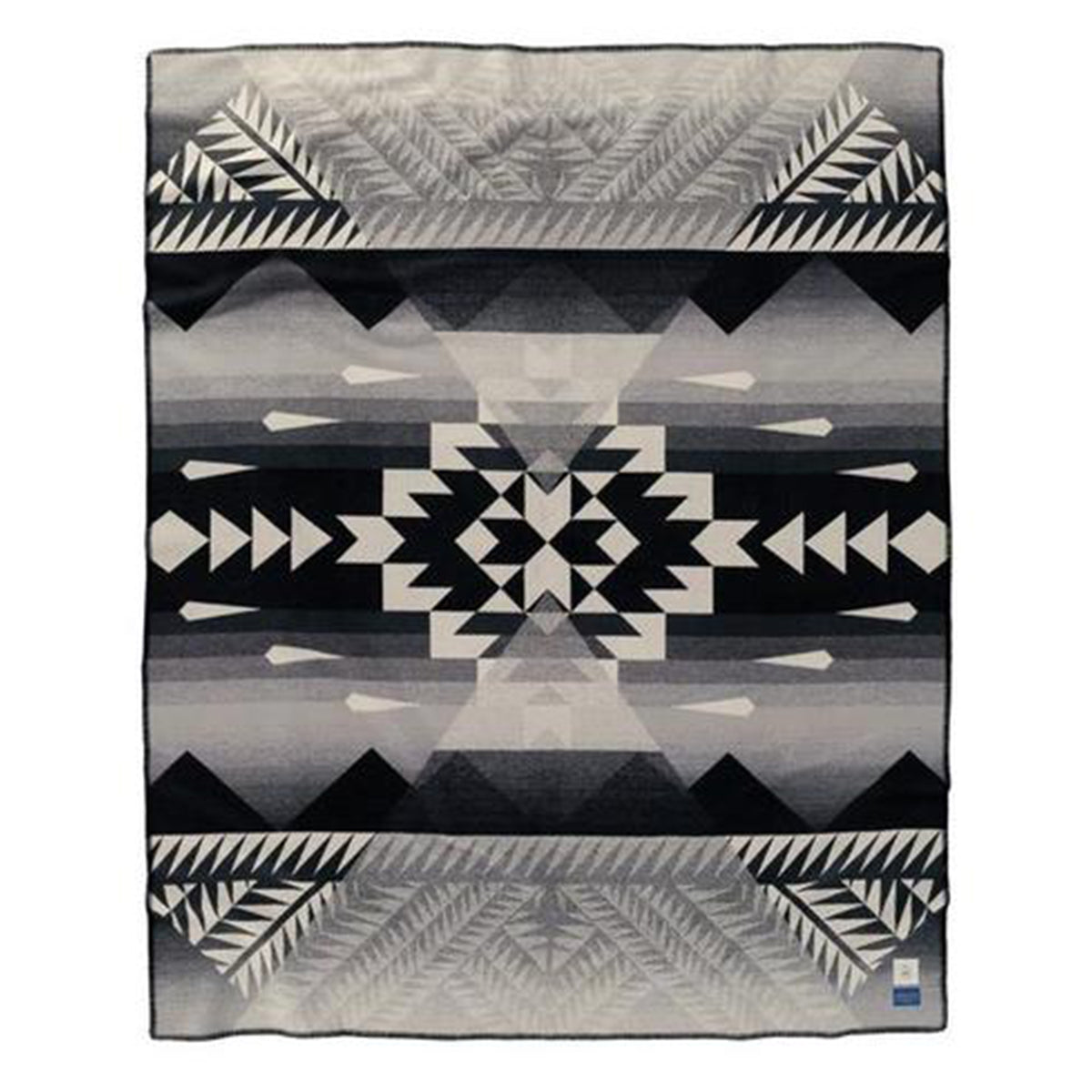 Pendleton blankets are heirloom-quality wool blankets made in the USA using wool that sourced from ranches around the country. This design is inspired by Indigenous American dress and was a creative collabertaion between Nike N7 and Pendleton Woolen Mills. The centre of the blanket prominently features the Nike N7 mark, and the blanket includes the iconic blue Pendleton Woolen Mills and black and cream Nike N7 labels.