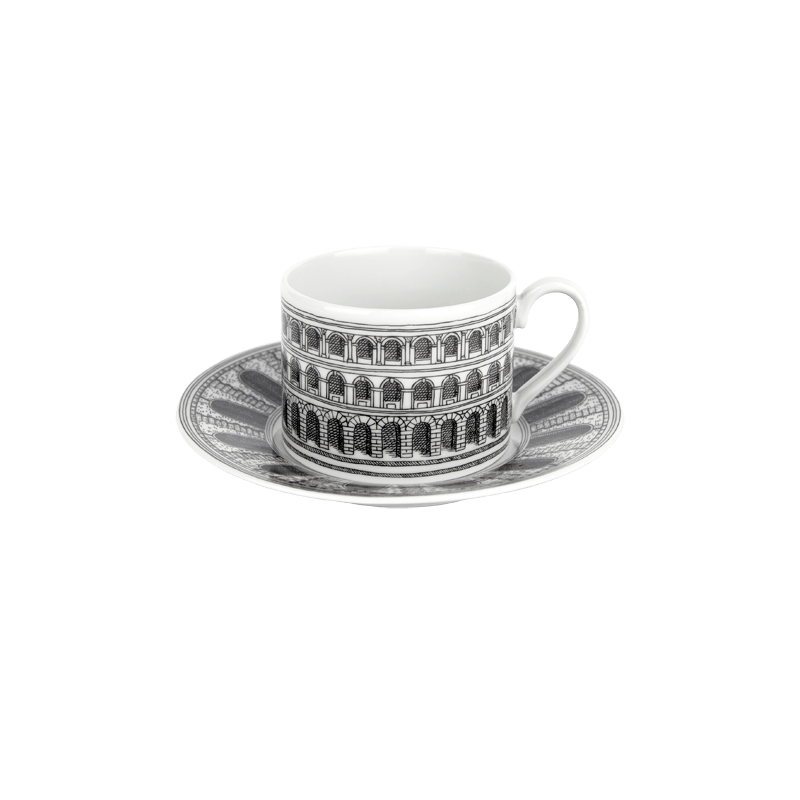 The Fornasetti architettura teacup and saucer are created of fine bone china and add a graphic punch to tea time