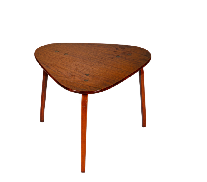 This vintage triangular side table is a sleek accent table and adds an extra layer of visual interest to any room. 